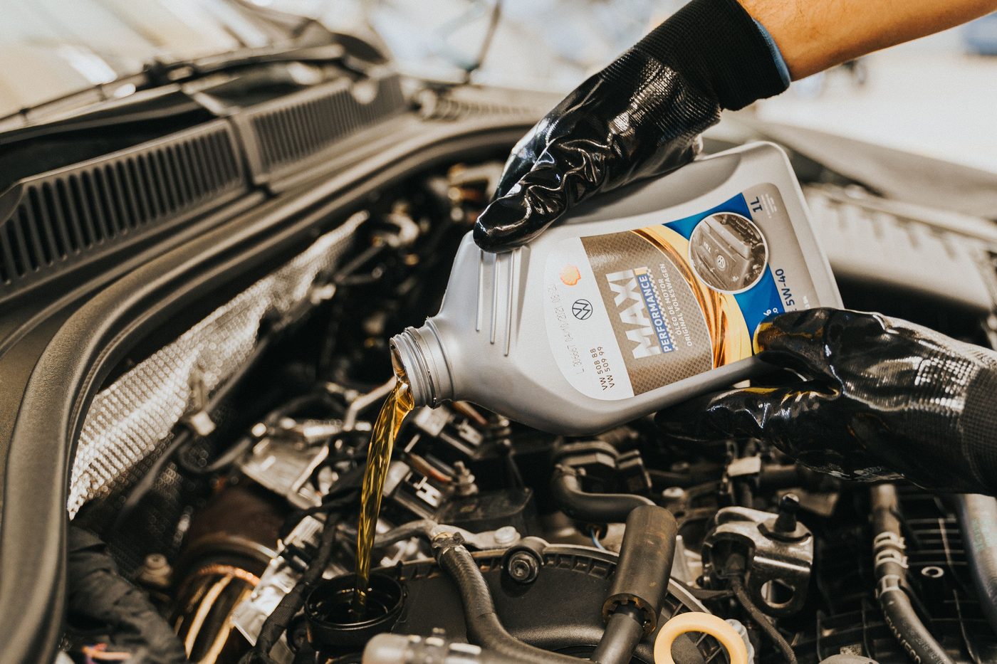 Fresh oil being poured into an engine